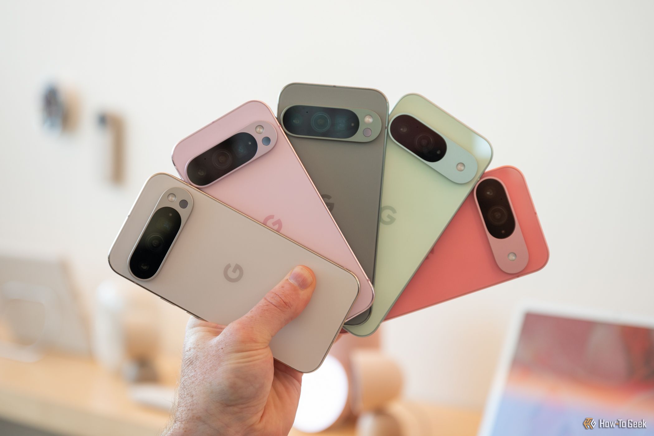 person-holding-multiple-google-pixel-9-and-9-pro-smartphones-2 Person holding multiple Google Pixel 9 and 9 Pro smartphones
