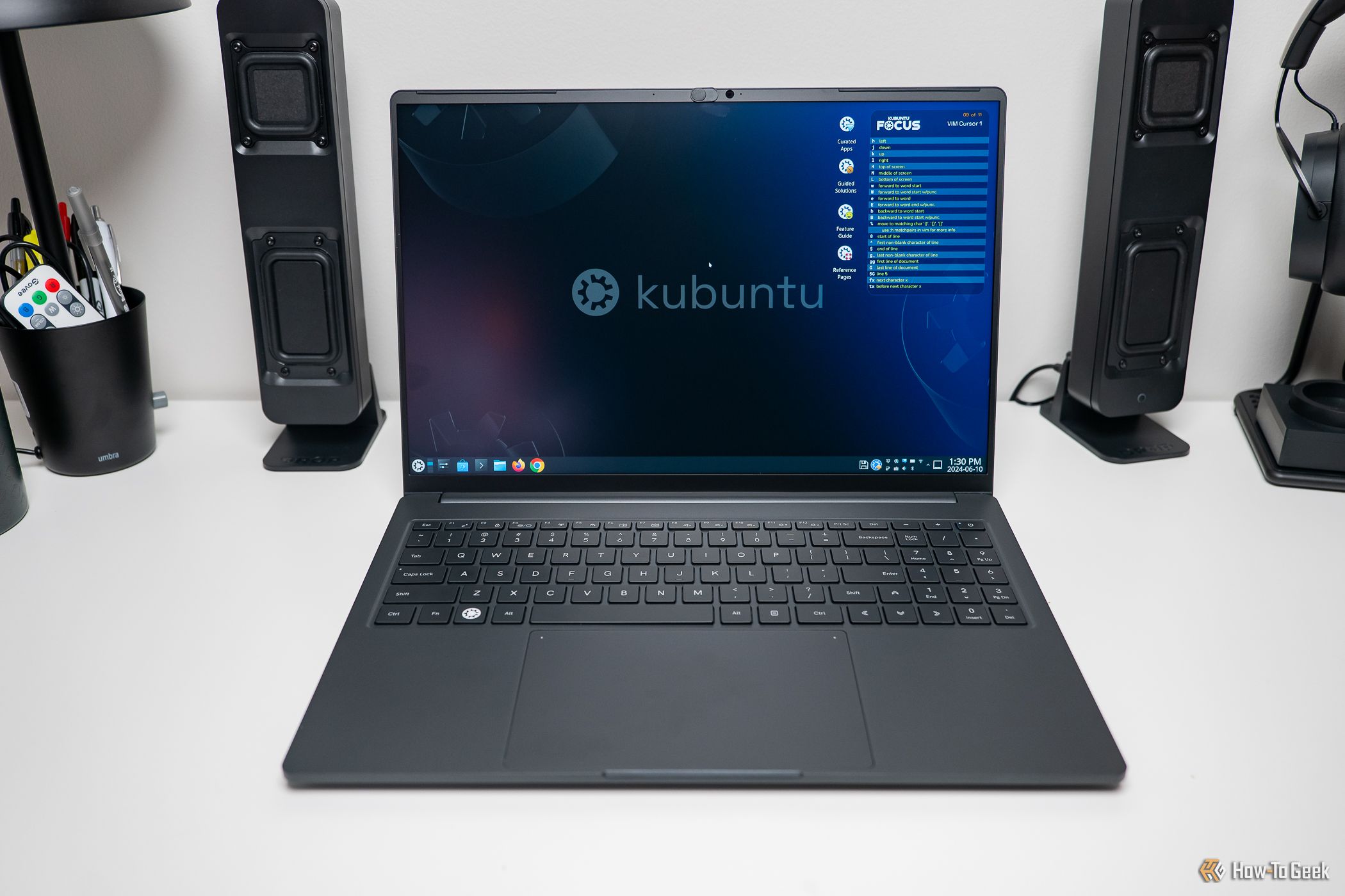 The Kubuntu Focus Ir16 Gen 2 laptop open and on a desk.