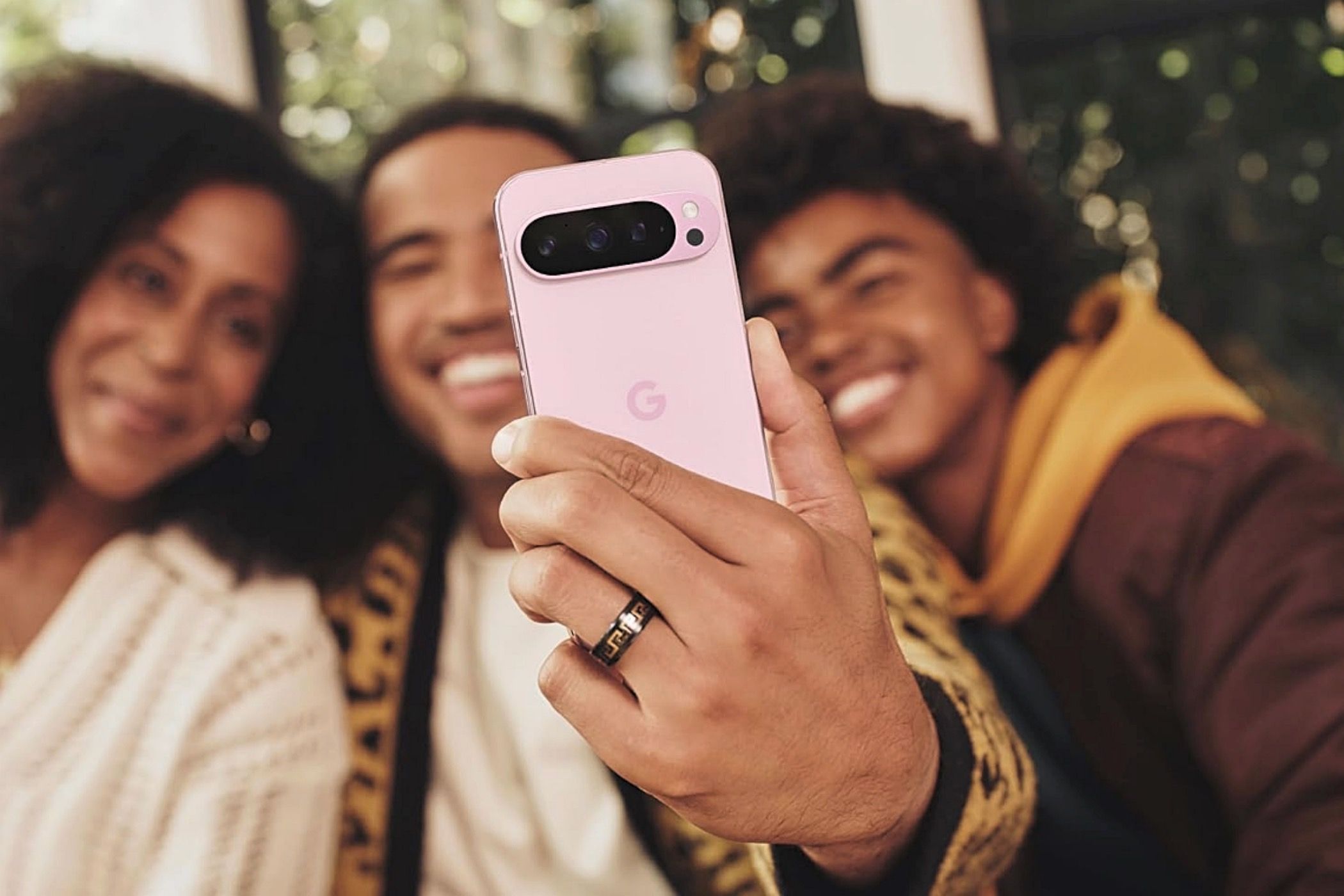 google-pixel-9-pro-xl A group of people taking a selfie with the Google Pixel 9 Pro XL.