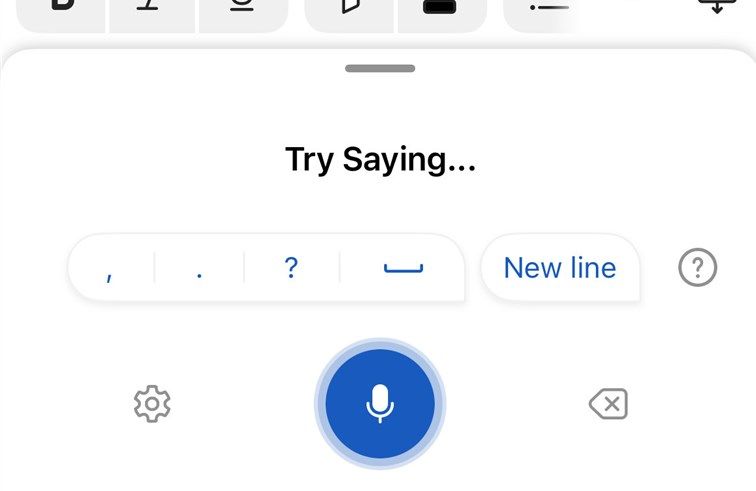 The dictation tool in the Microsoft Word iOS mobile app is active, with the blue microphone icon flashing.