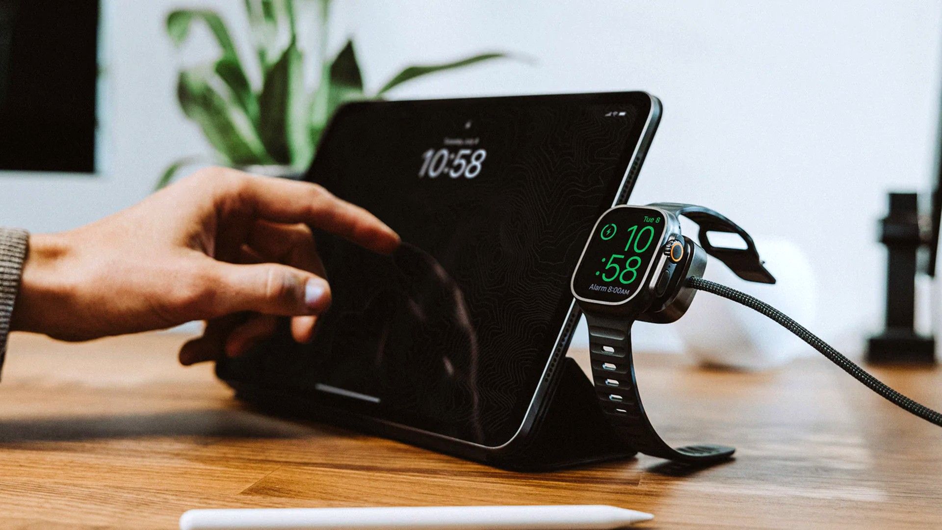 Universal Cable for Apple Watch in use on a table next to a tablet