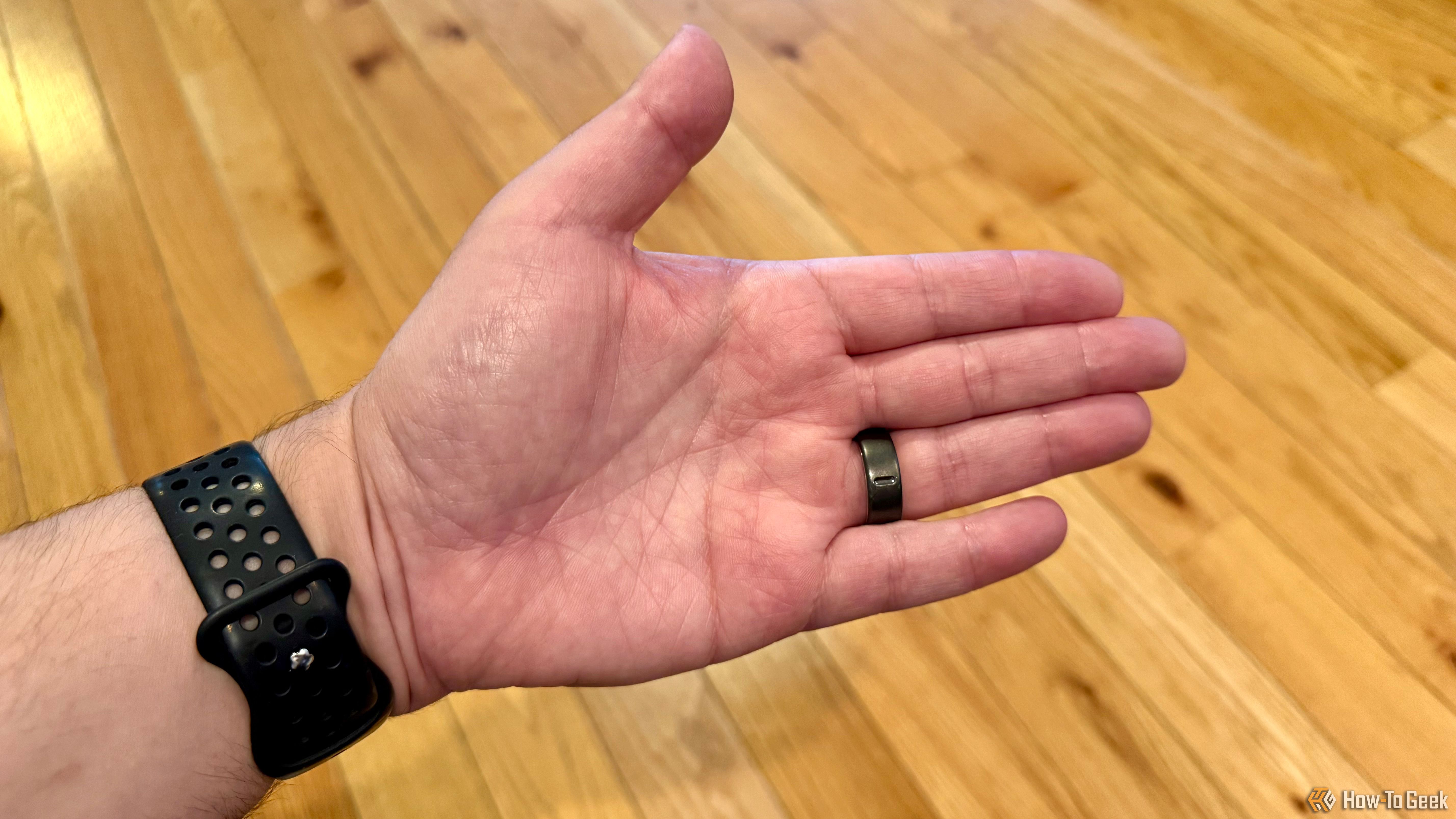 Outstretched hand showing palm and underside of Oura Ring 4.