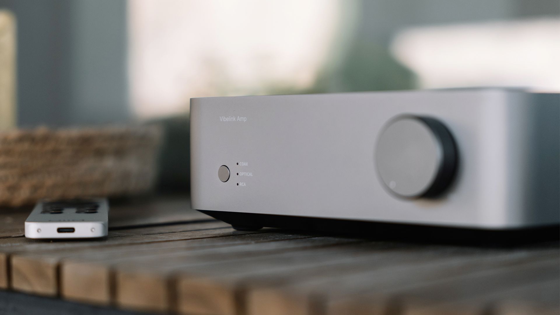 The WiiM Vibelink Amplifier on a table.