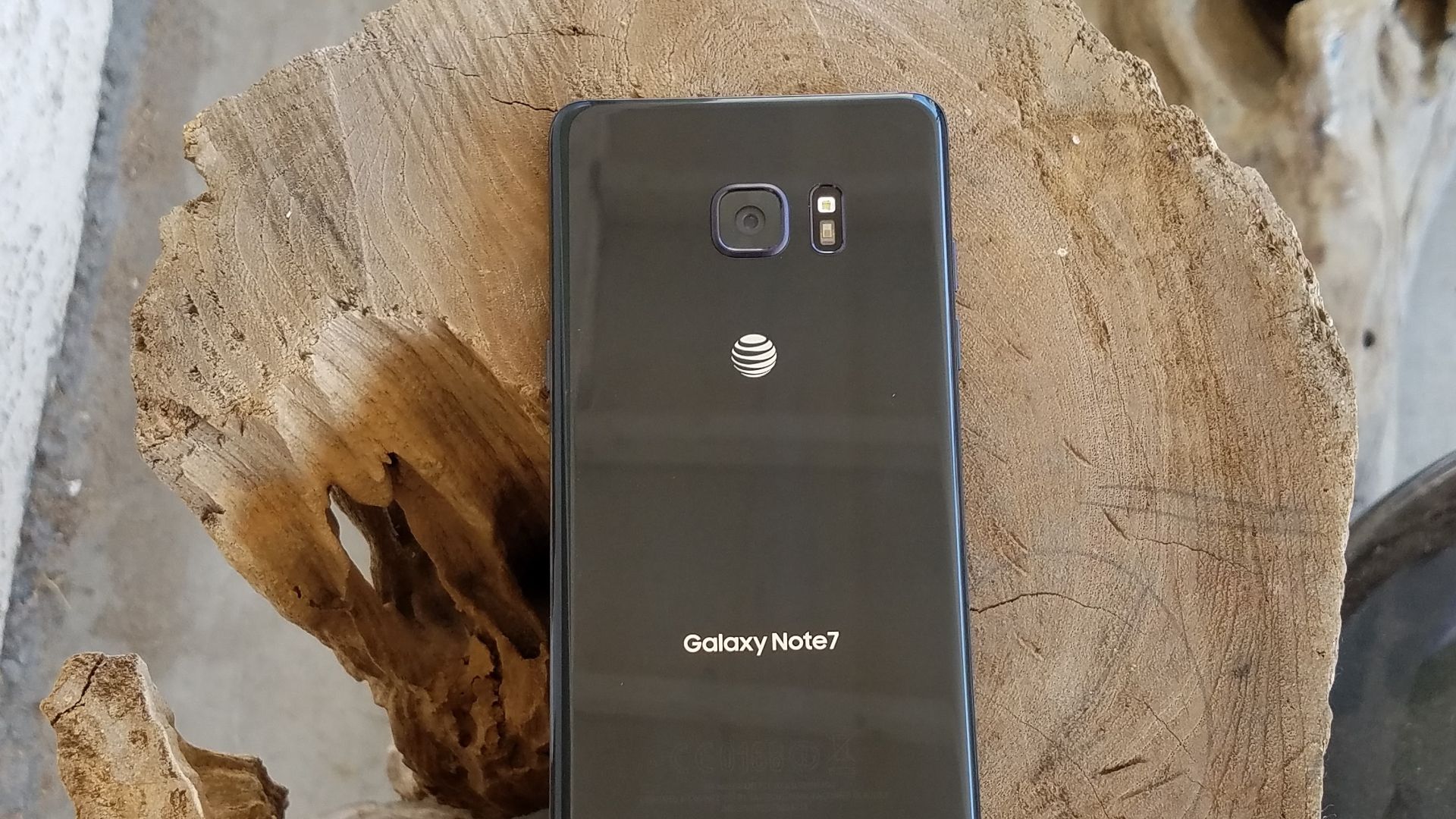 Galaxy Note 7 on a block of wood.