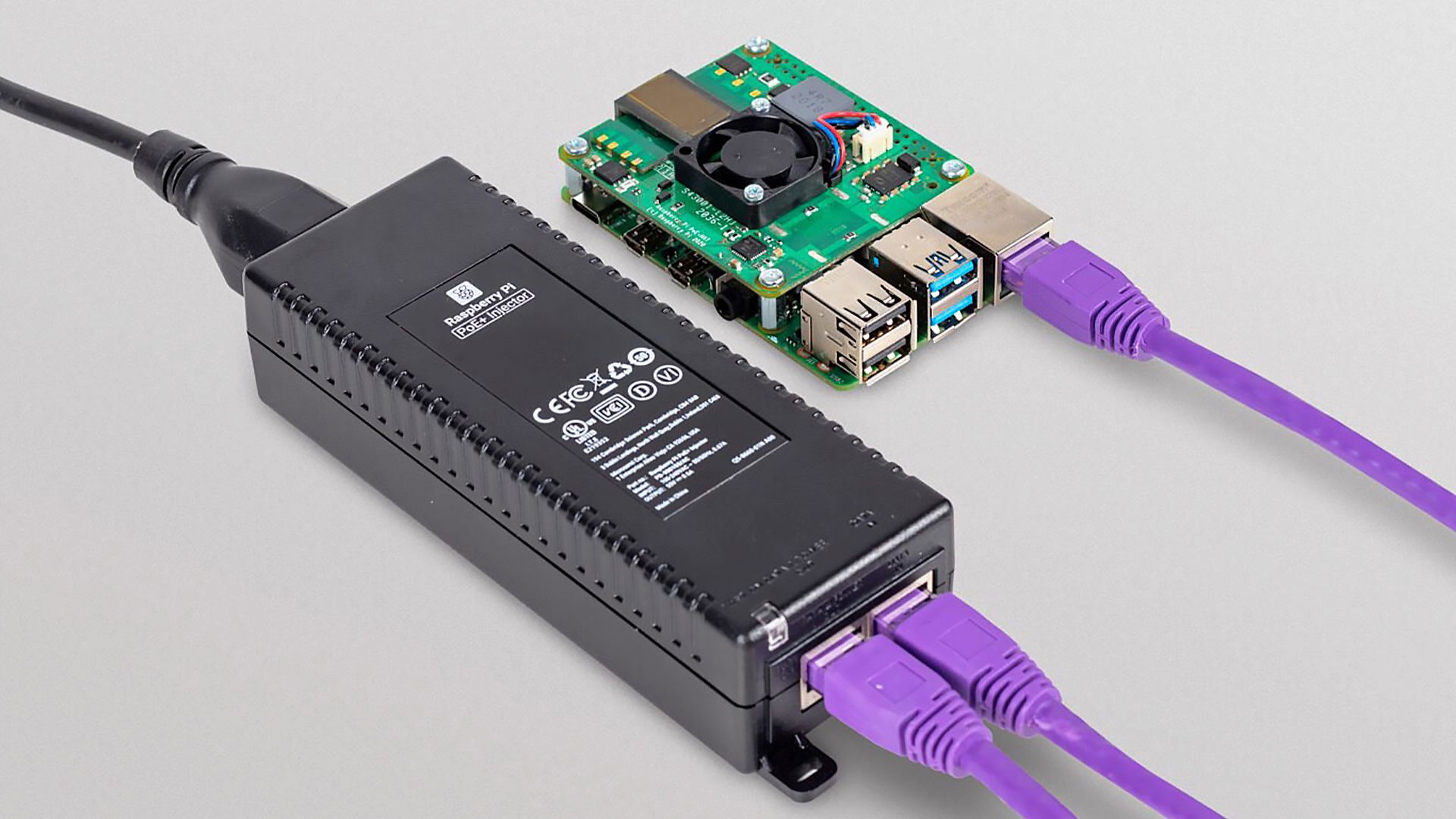 The Raspberry Pi PoE+ Injector connected to a Raspberry Pi computer.