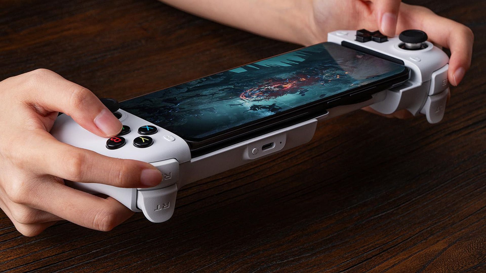Person playing a game with a 8Bitdo controller.