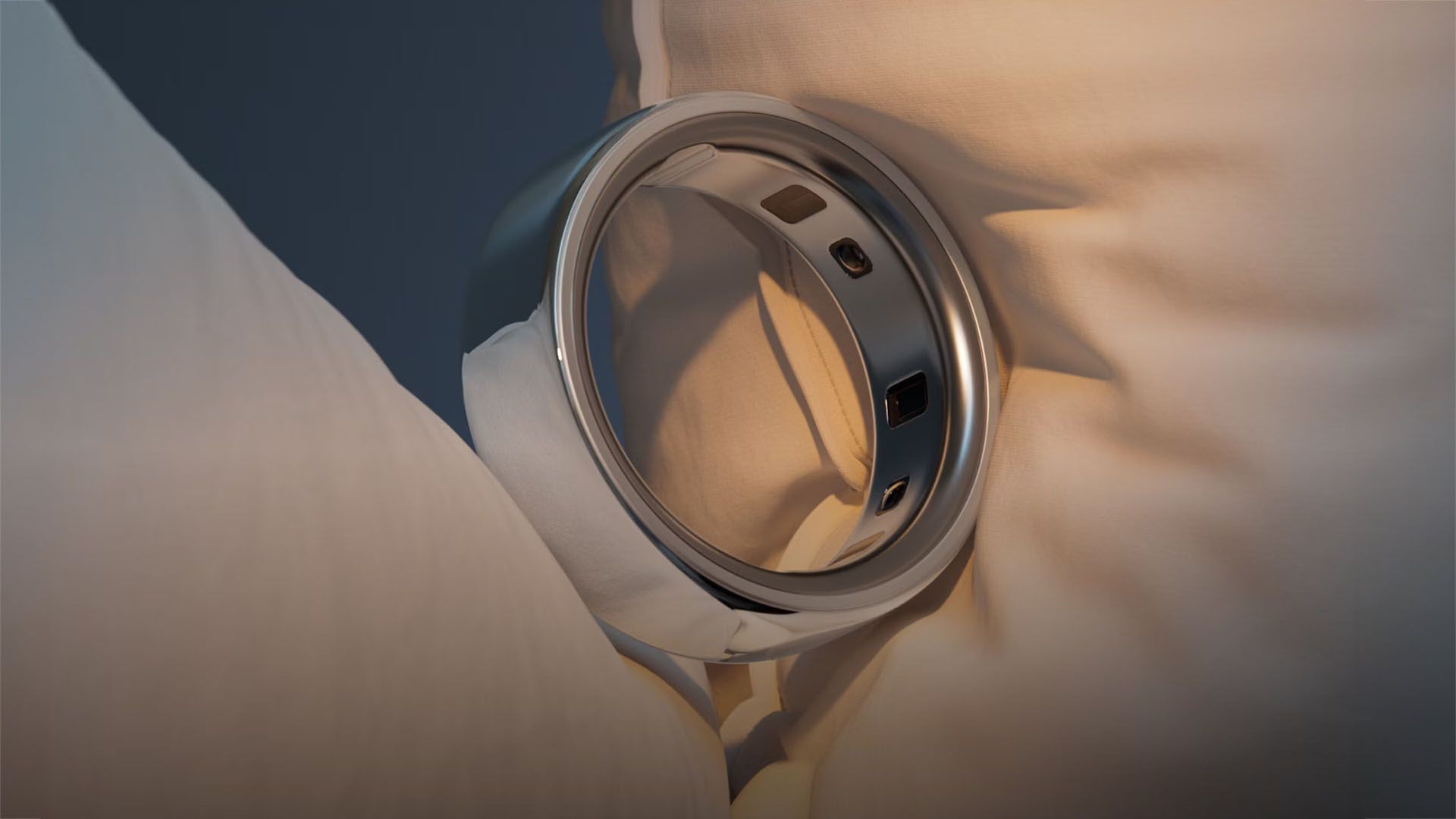 An Oura Ring on a pillow.