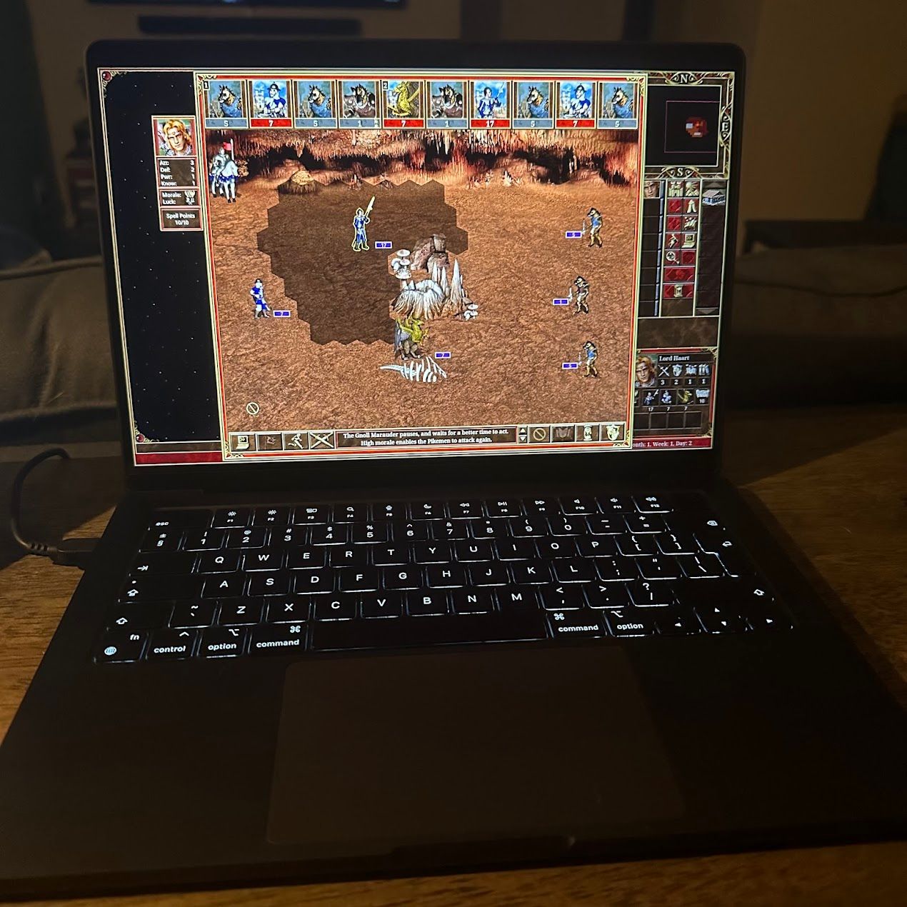 Heroes of Might and Magic III running on a MacBook.