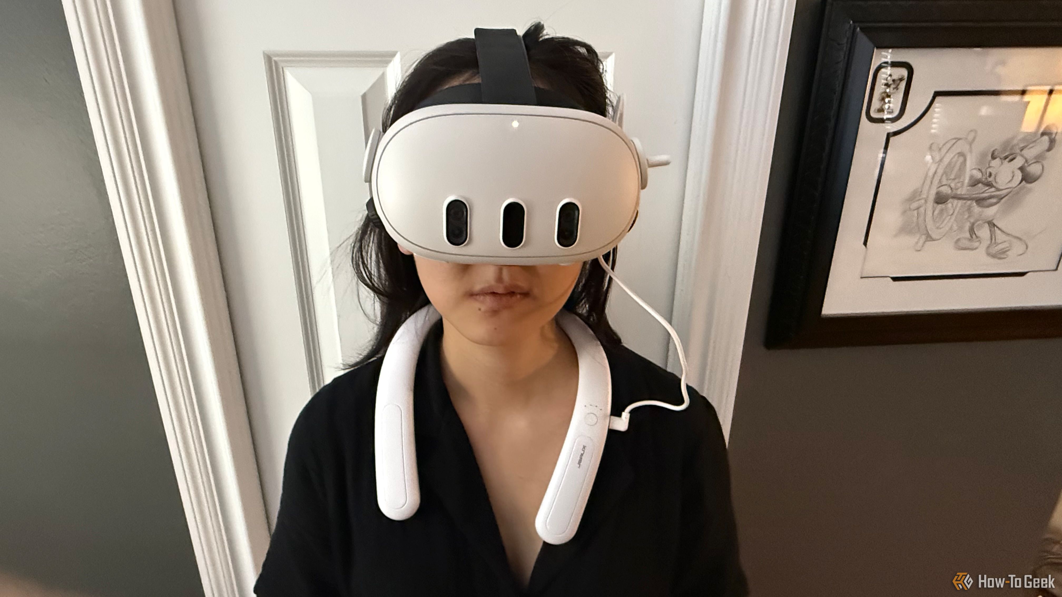 Woman wearing a Meta Quest 3 and JSAUX battery pack.
