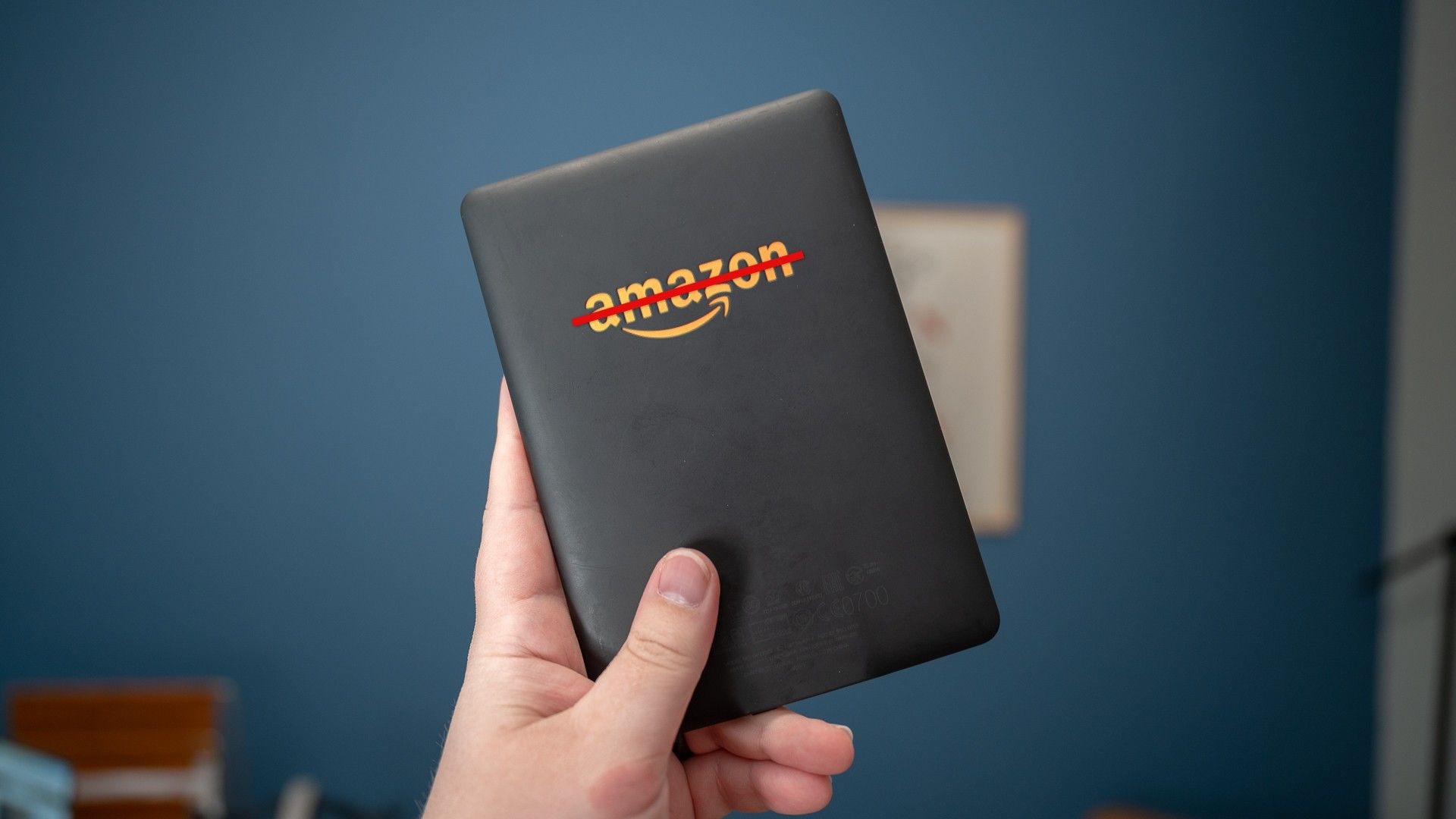 Kindle eReader with Amazon logo crossed out.
