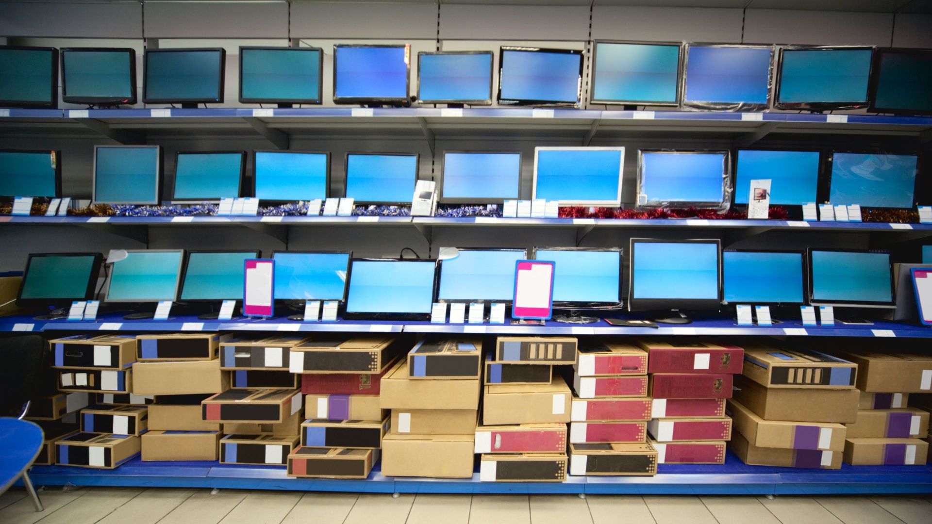 Rack with liquid crystal displays and monitors in electronics shop