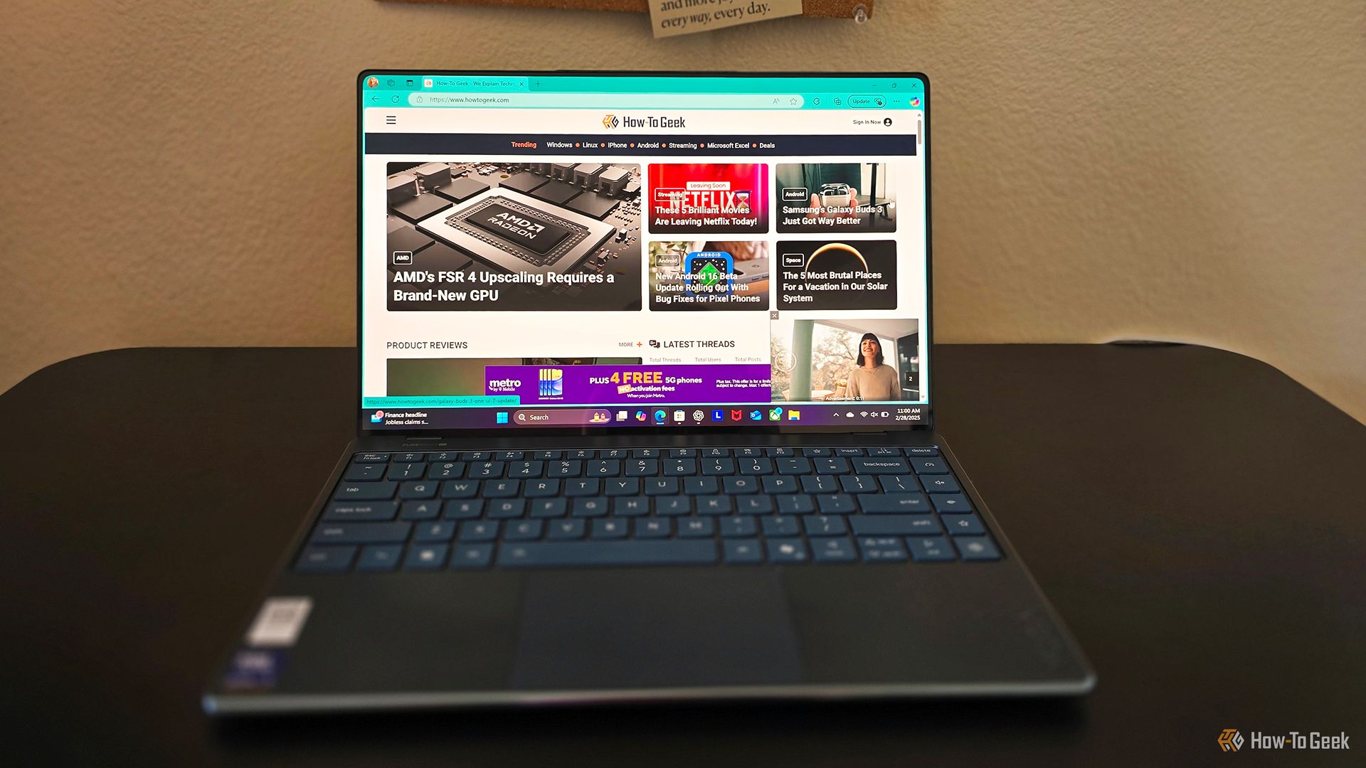 The Lenovo Yoga Slim 9i Gen 10 laptop open on a desk.