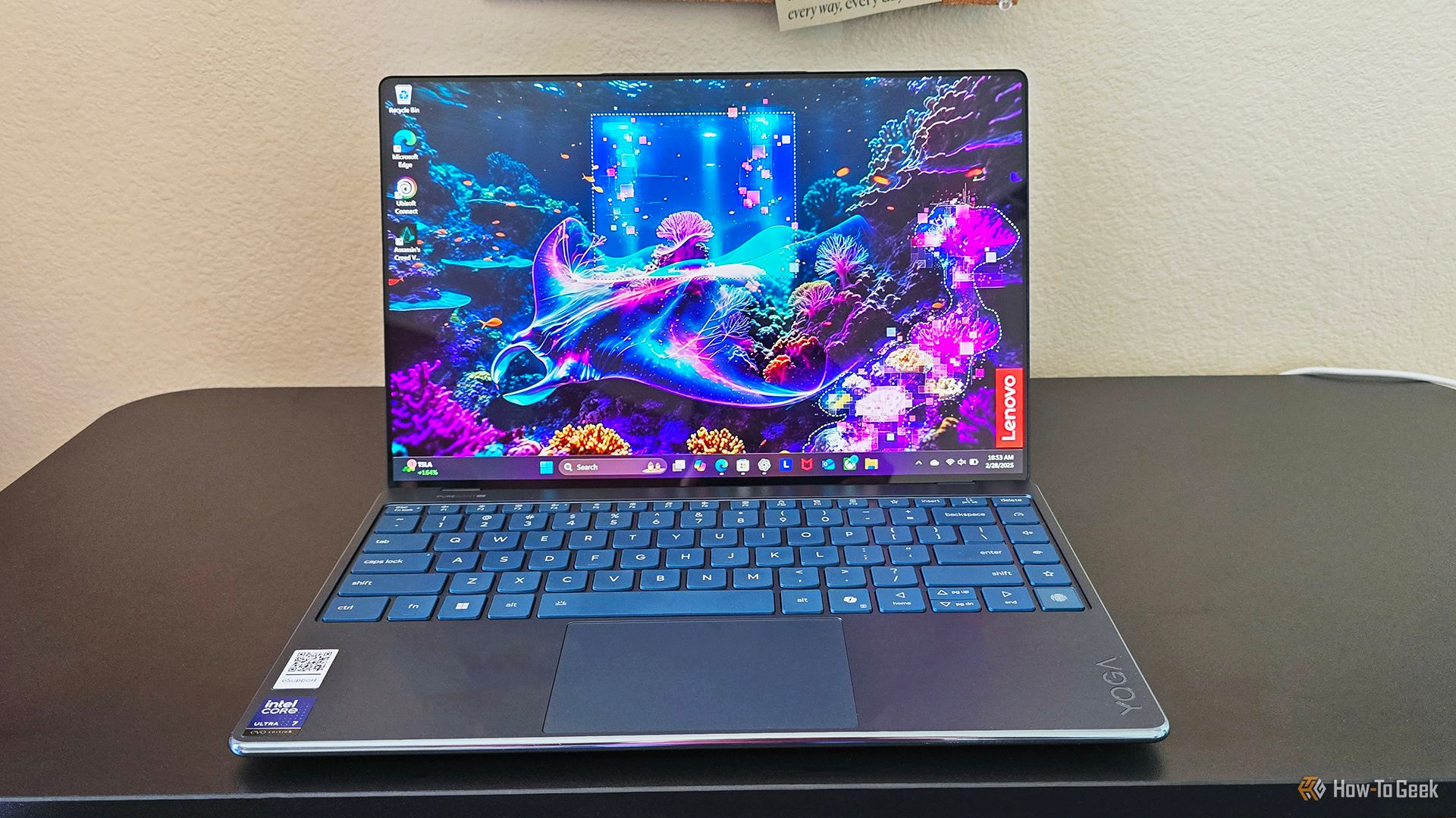 The Lenovo Yoga Slim 9i Gen 10 laptop open on a desk.