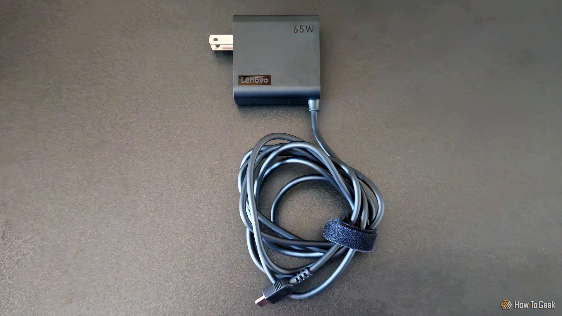 The Lenovo Yoga Slim 9i Gen 10 laptop's 65W charger.