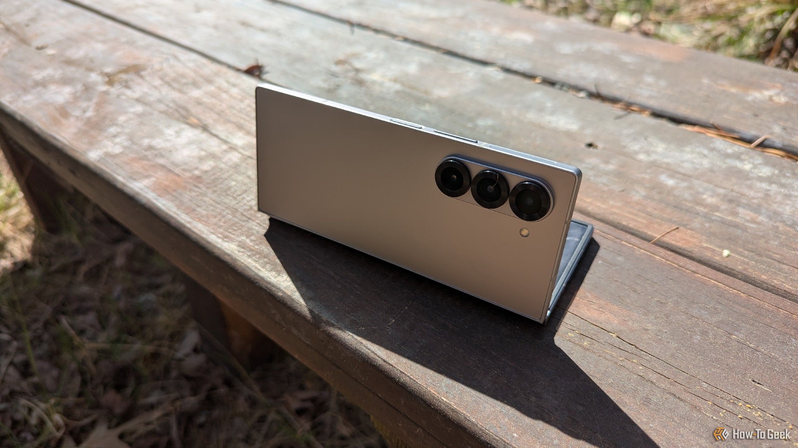 A Samsung Galaxy Z Fold 6 on a bench, being used as a tripod.
