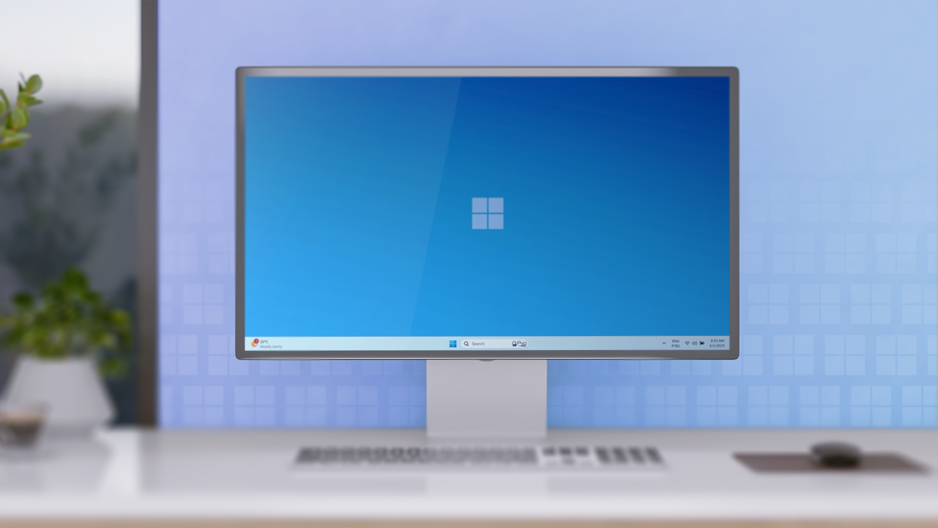 A minimalist office desk with a desktop running Windows 11.