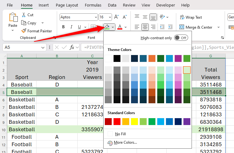 A row is selected in an Excel spreadsheet, and a light green fill is applied through direct formatting.