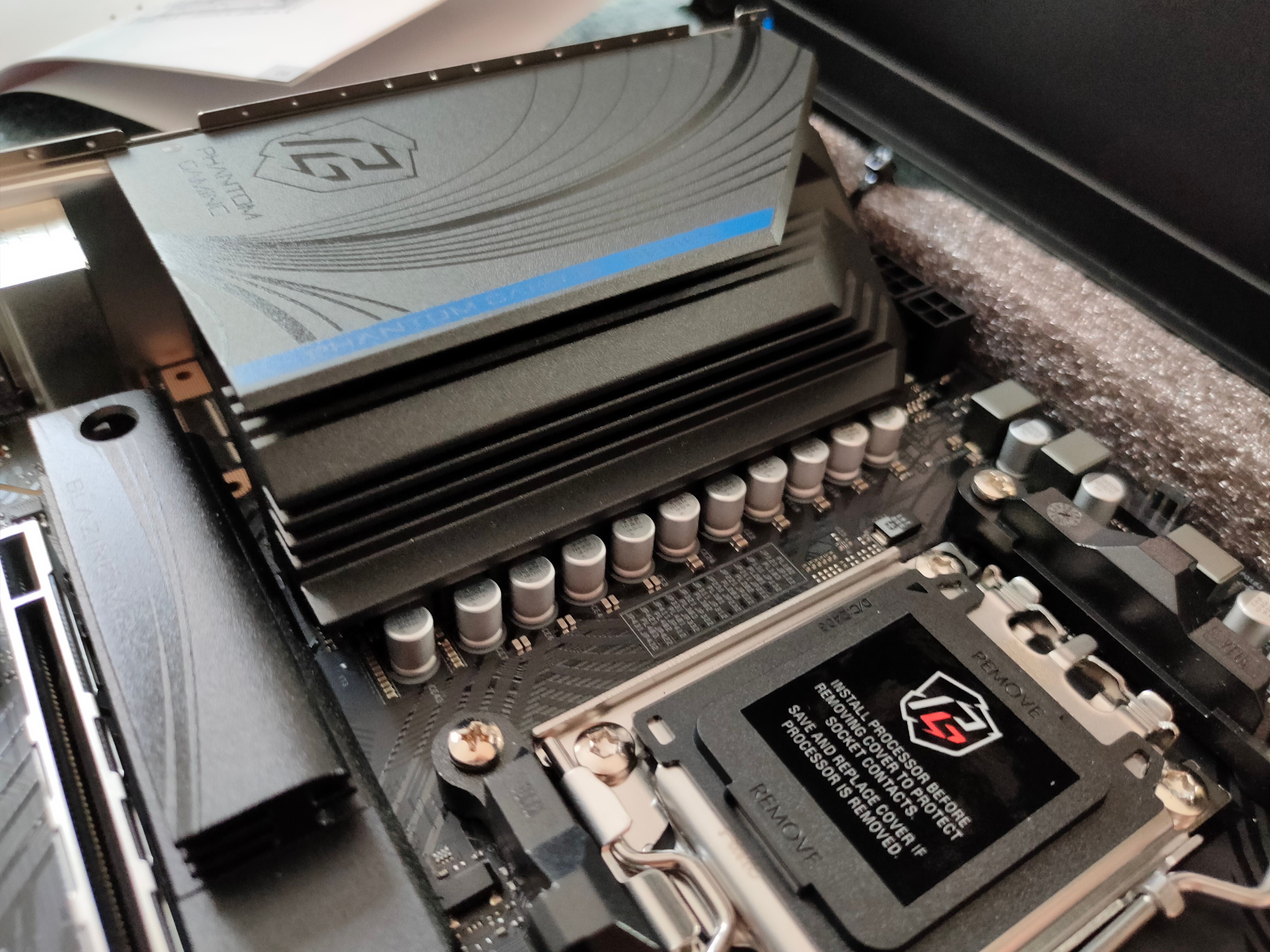 A heatsink covering the VRMs of a AsRock B650M PG Riptide motherboard.