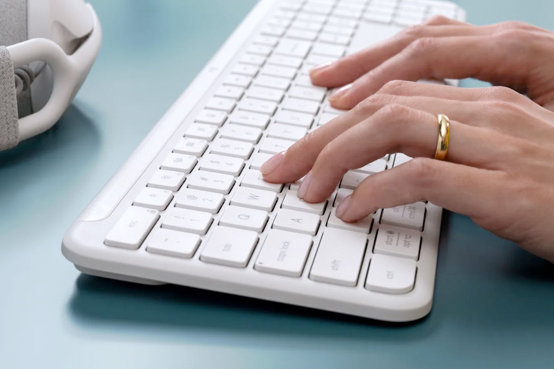 Person typing on a keyboard.