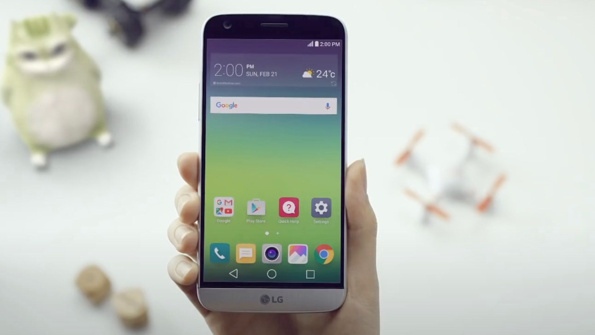 A hand holding the LG G5 phone.