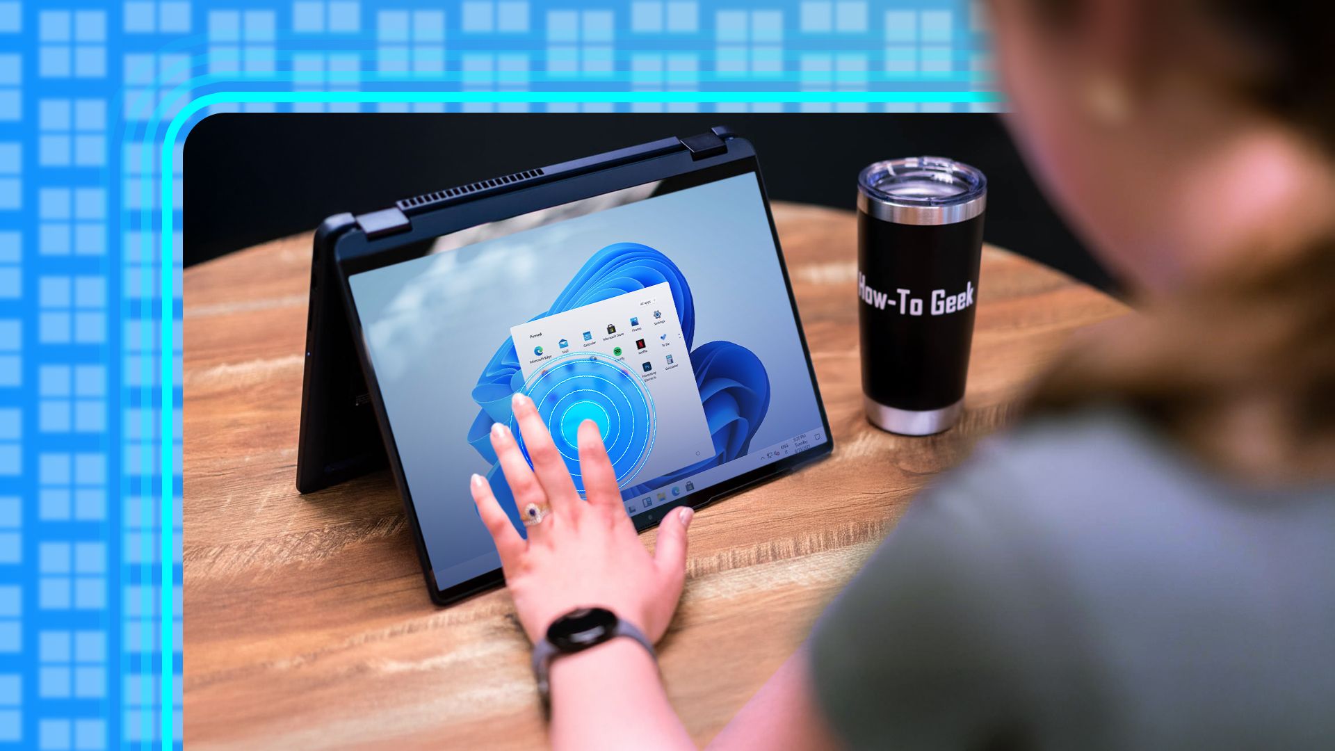 Person using the touch screen on a windows 11 laptop.