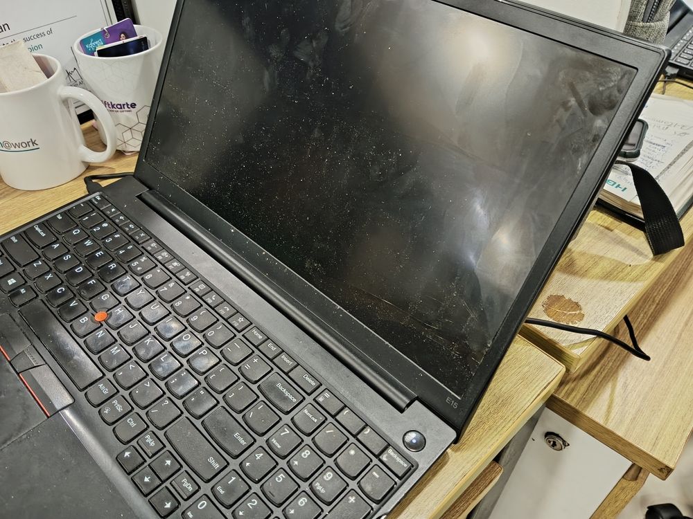 A laptop with an exceptionally dirty screen.