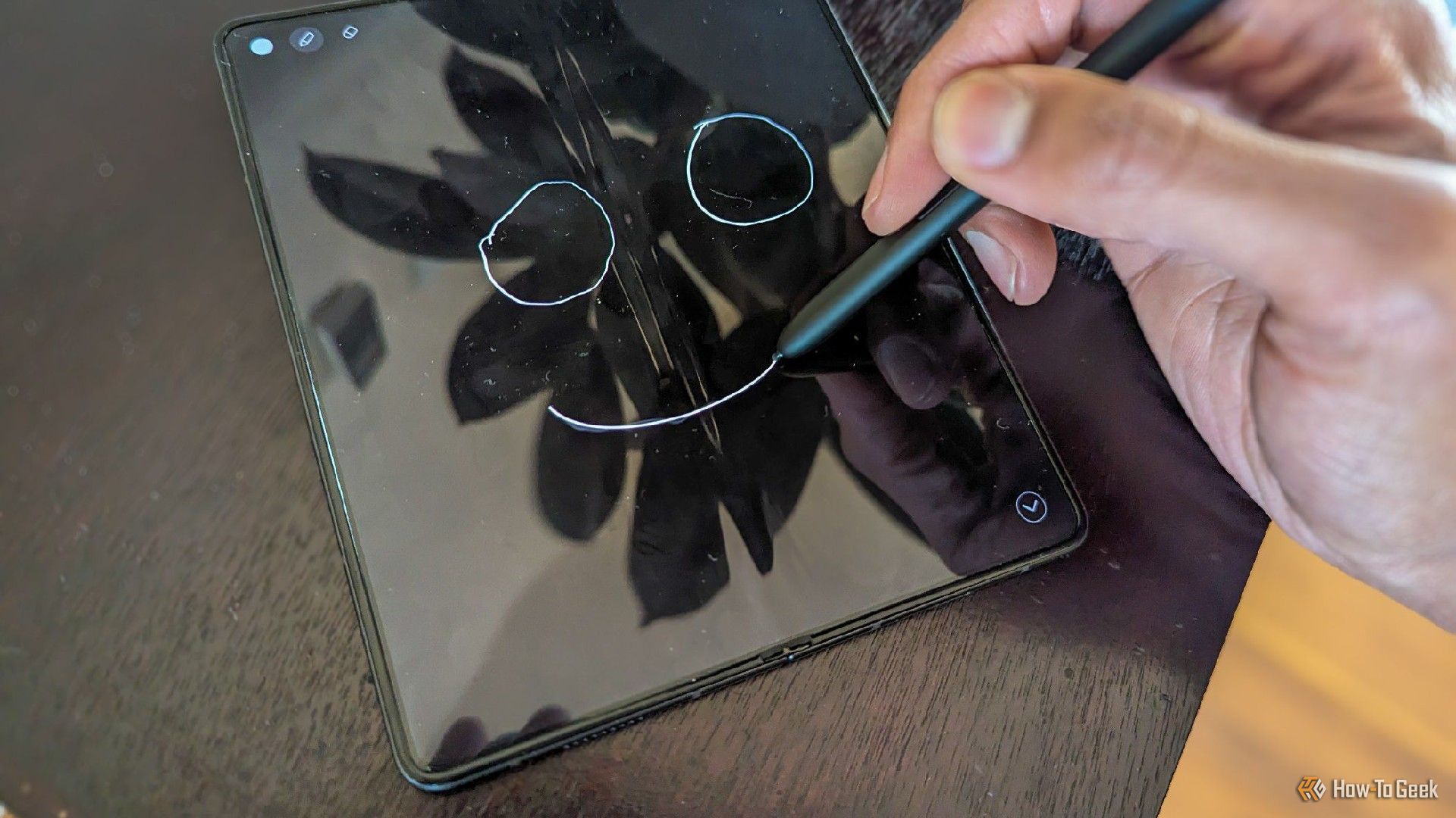 Drawing on a Galaxy Z Fold 5 using an S Pen.