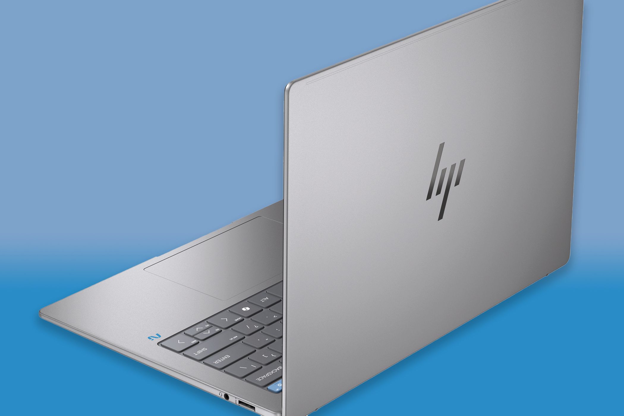The HP OmniBook X on a blue background.