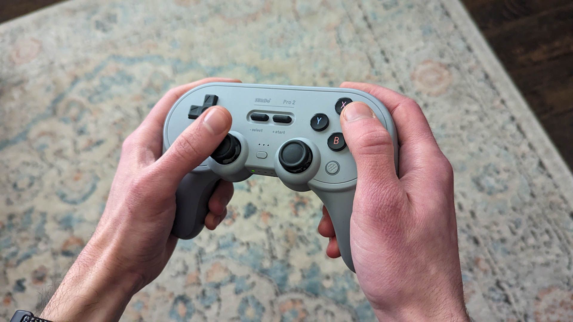 8Bitdo Pro 2 wireless controller in hand