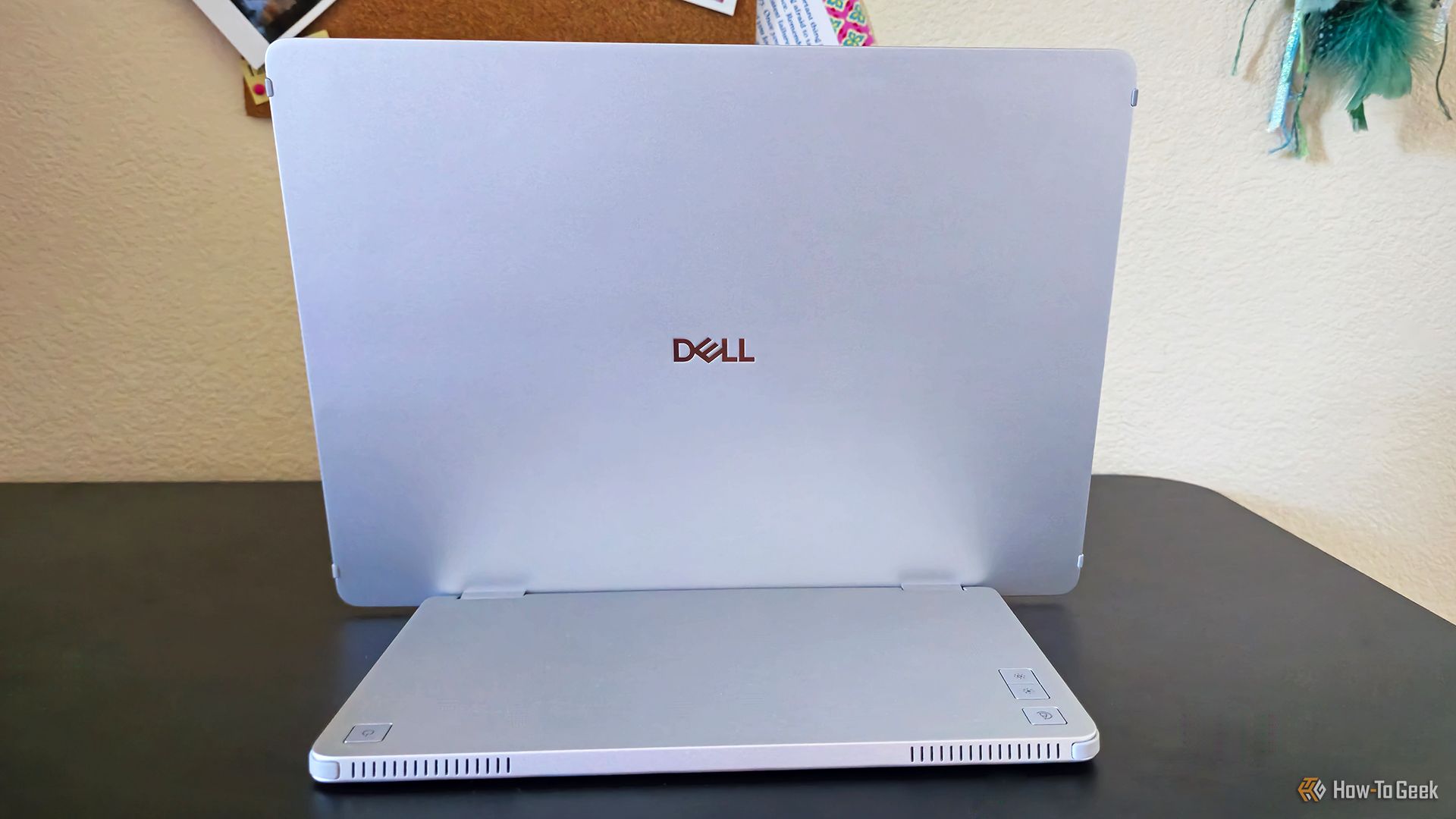 The back of the Dell Pro 14 Plus Portable Monitor (P1245) sitting on a desk.